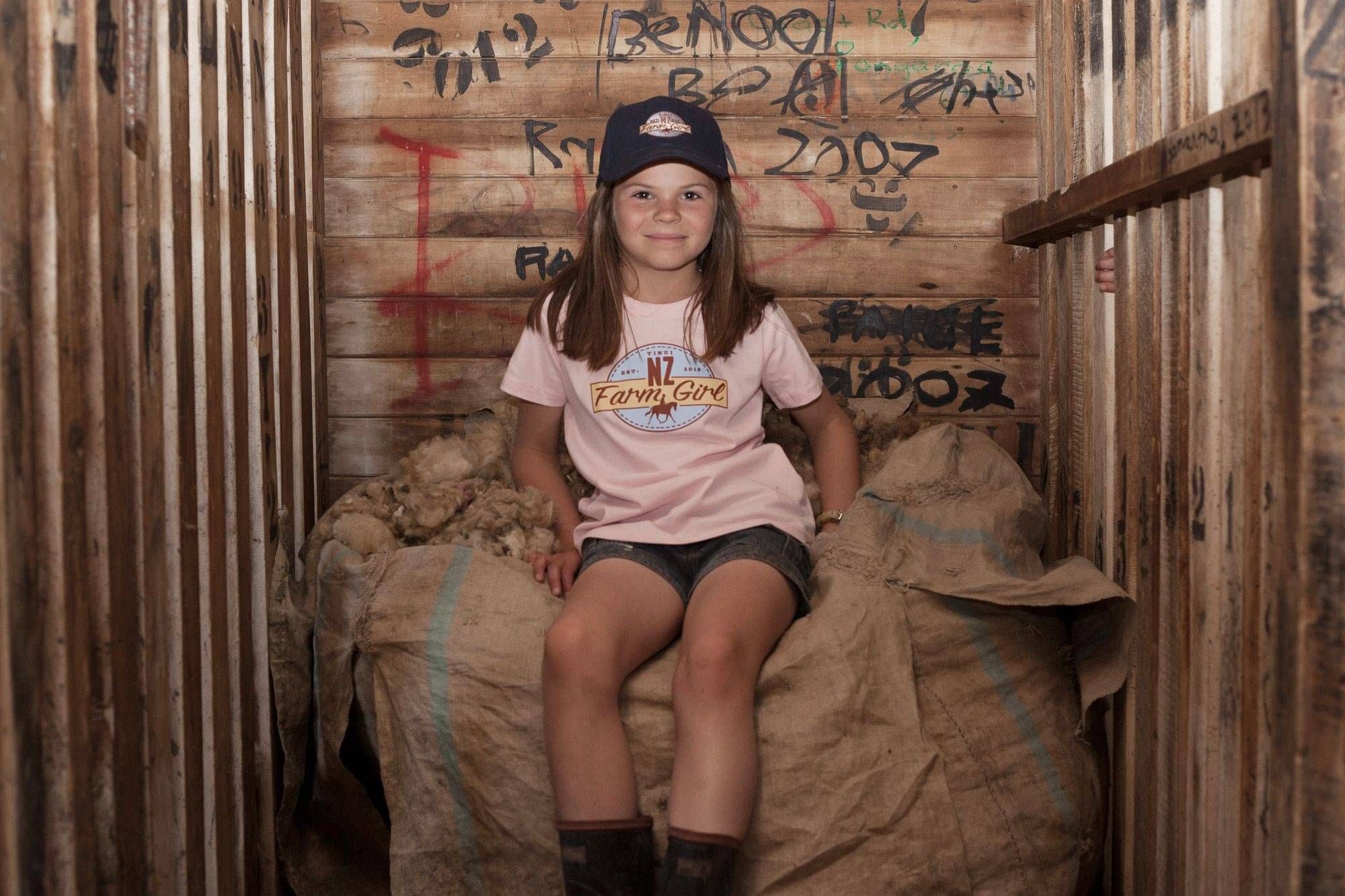 NZ Farm Girl pink tshirt and navy cap