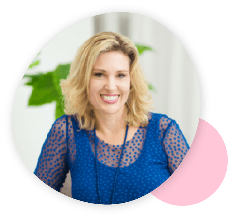 Smiling woman with shoulder-length blonde hair, wearing a blue polka dot top and necklace, framed by an abstract shape with a pink accent