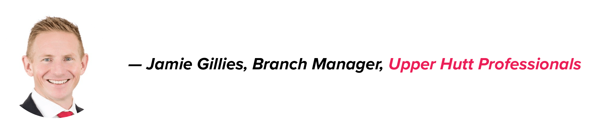 Jamie Gillies, Branch Manager of Upper Hutt Professionals, in a black suit, white shirt, and red tie, with his name in black and company in pink