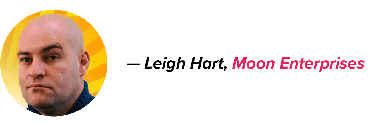 Leigh Hart, Moon Enterprises, against a yellow background, with a serious expression and a navy blue top; name in black, company name in pink