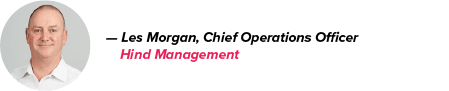 Les Morgan, Hind Management's Chief Operations Officer, is pictured in a white shirt with a neutral background; his name in black, company in pink
