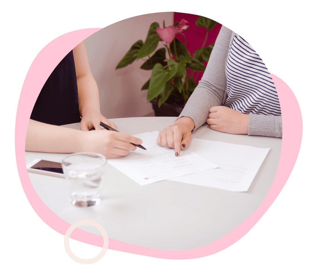 Desktop computer on a modern desk with "Get Savvy" displayed on the screen, surrounded by vibrant graphic shapes