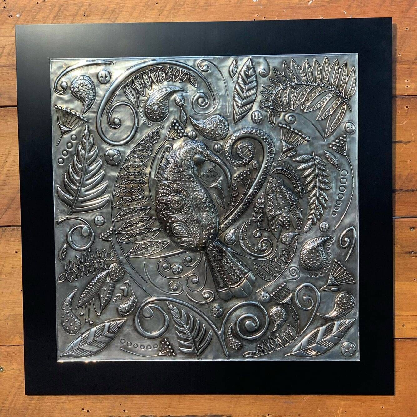 Huia's Lustrous Lacework pewter wall art by Ninette Kruger and Anna Mollekin, shown in full in its black frame