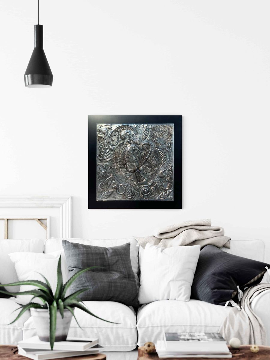 Huia's Lustrous Lacework pewter wall art styled above a sofa in a white living room