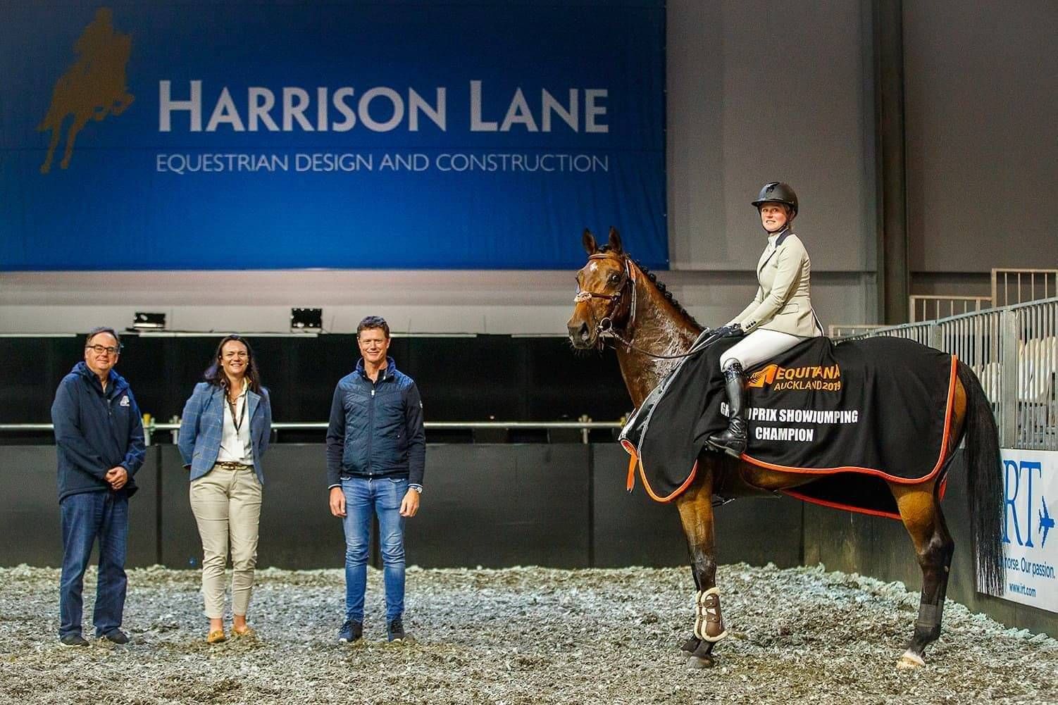 Laura Daly with Bruce Goodin and Rod Lockwood at Equitana 2019 with Grand Prix Show Jumping Champioin