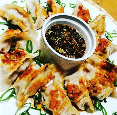 Asian Pork &amp; Ginger Dumplings with our signature Dipping sauce (FROZEN)