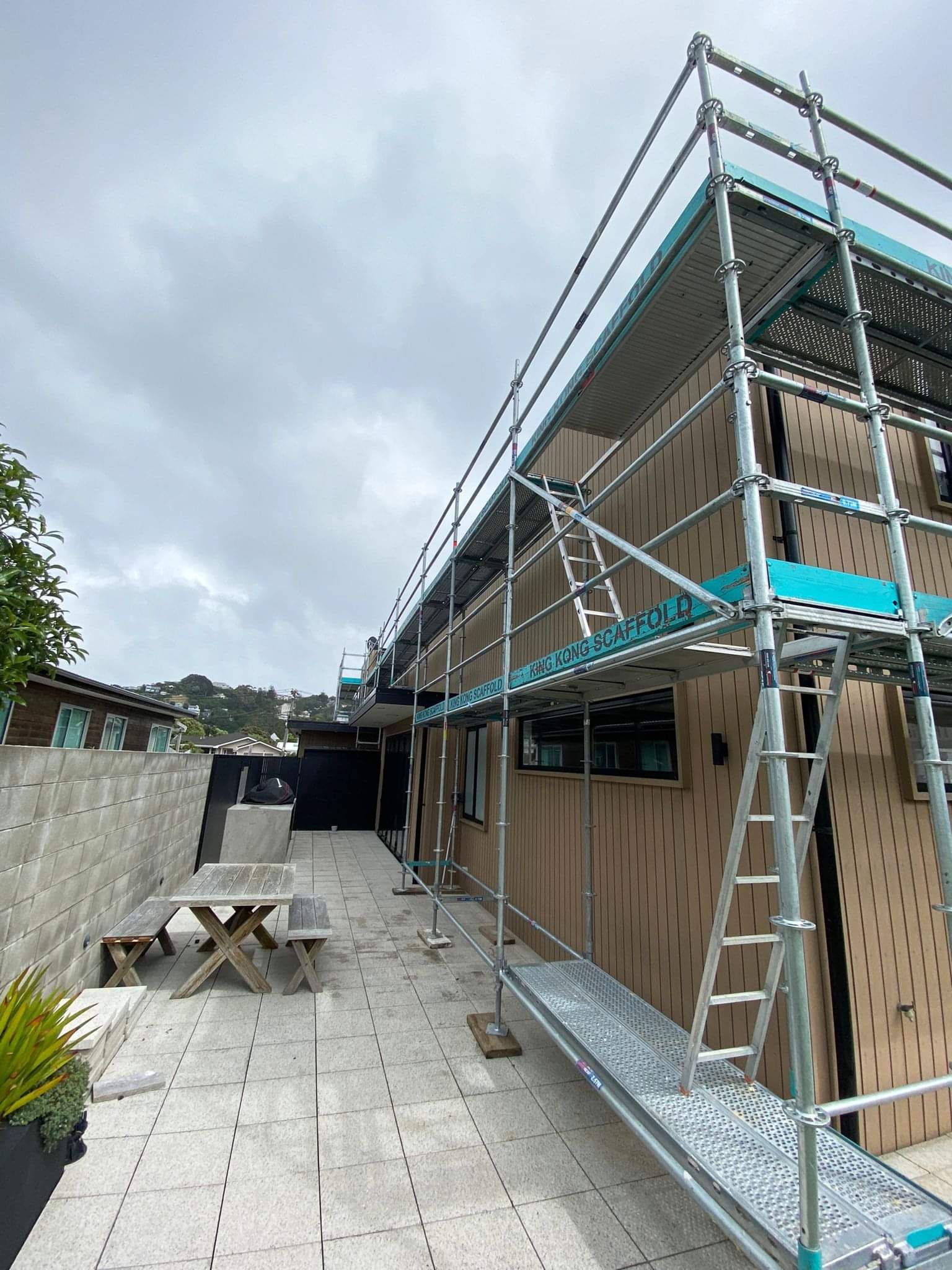 King Kong Scaffold setup on a residential property with a truck on-site, showing reliable scaffolding hire Wellington services.