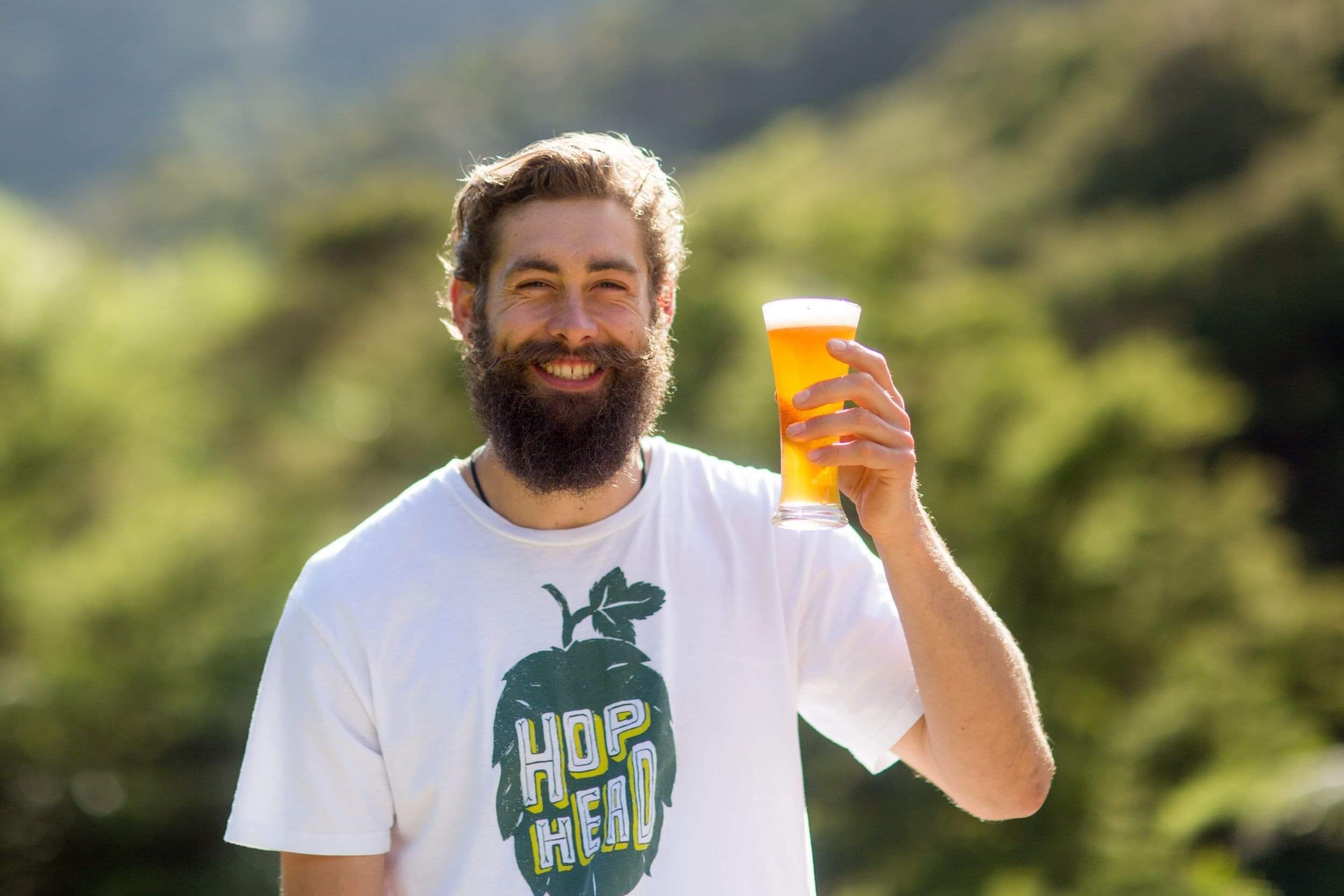 Adam Coleman-Smith of Blue Fridge Brewery (Kuaotunu) holding a glass of beer