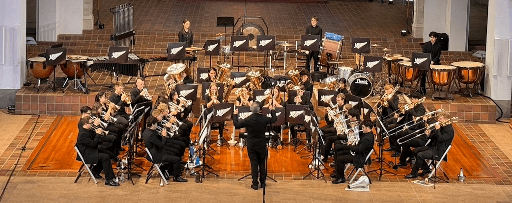 Brass band made up of youth players playing on stage at the Parnell Trinity Cathedral in Auckland.
