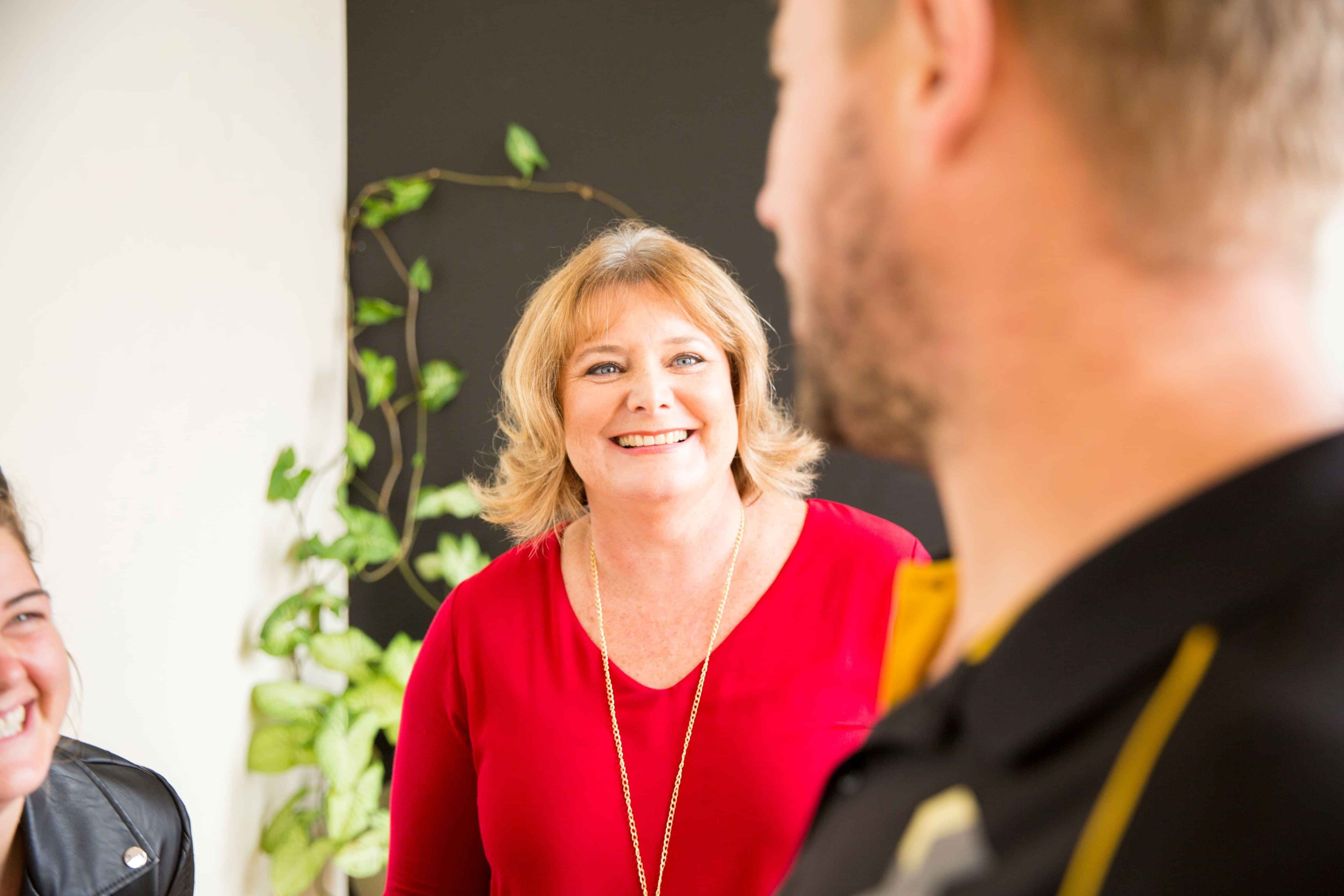 Image of Helen Laidlaw, Hamilton Business Advisor chatting with client. Waikato, New Zealand.