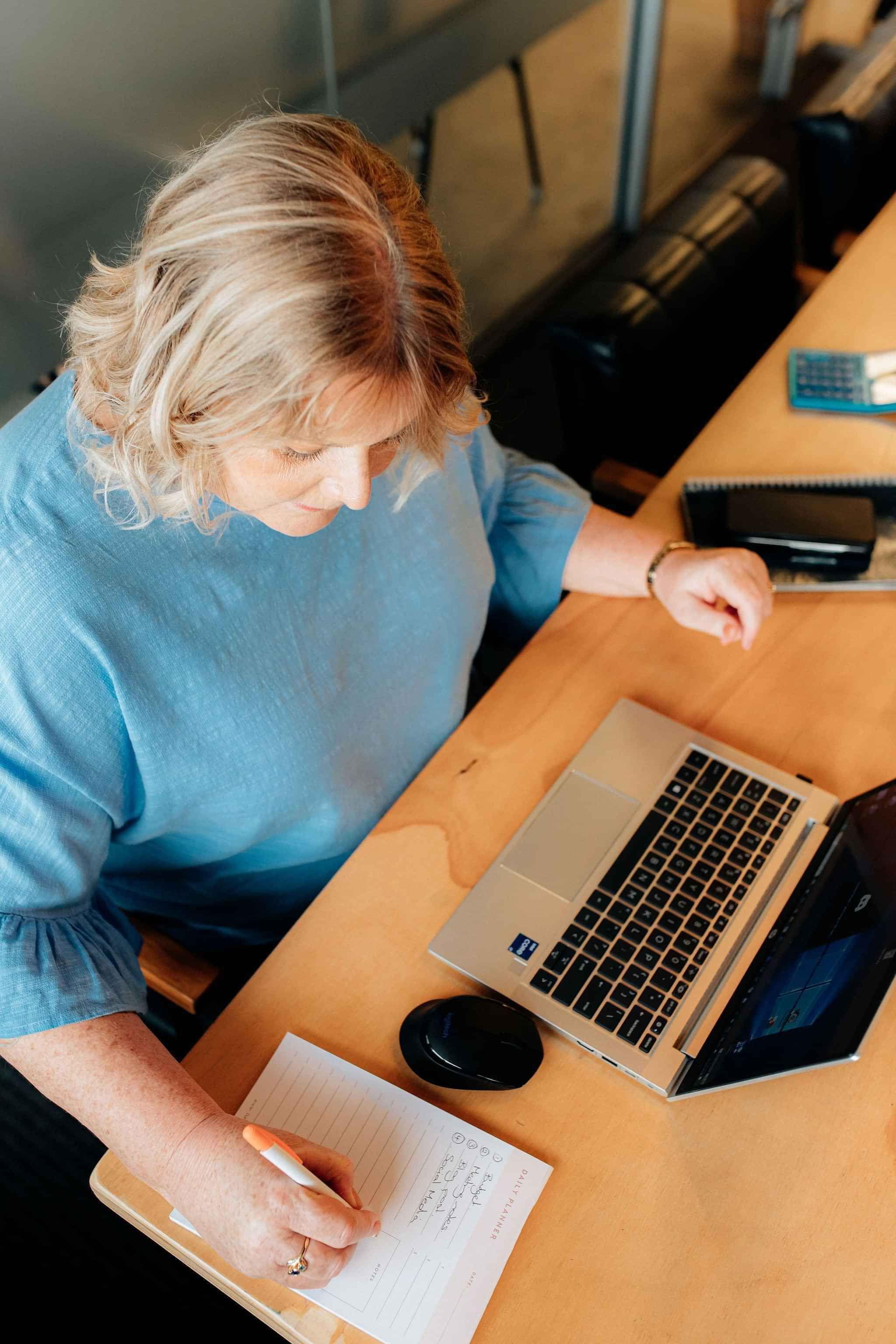 Image of Helen Laidlaw, Hamilton Business Advisor planning with client. Waikato, New Zealand.
