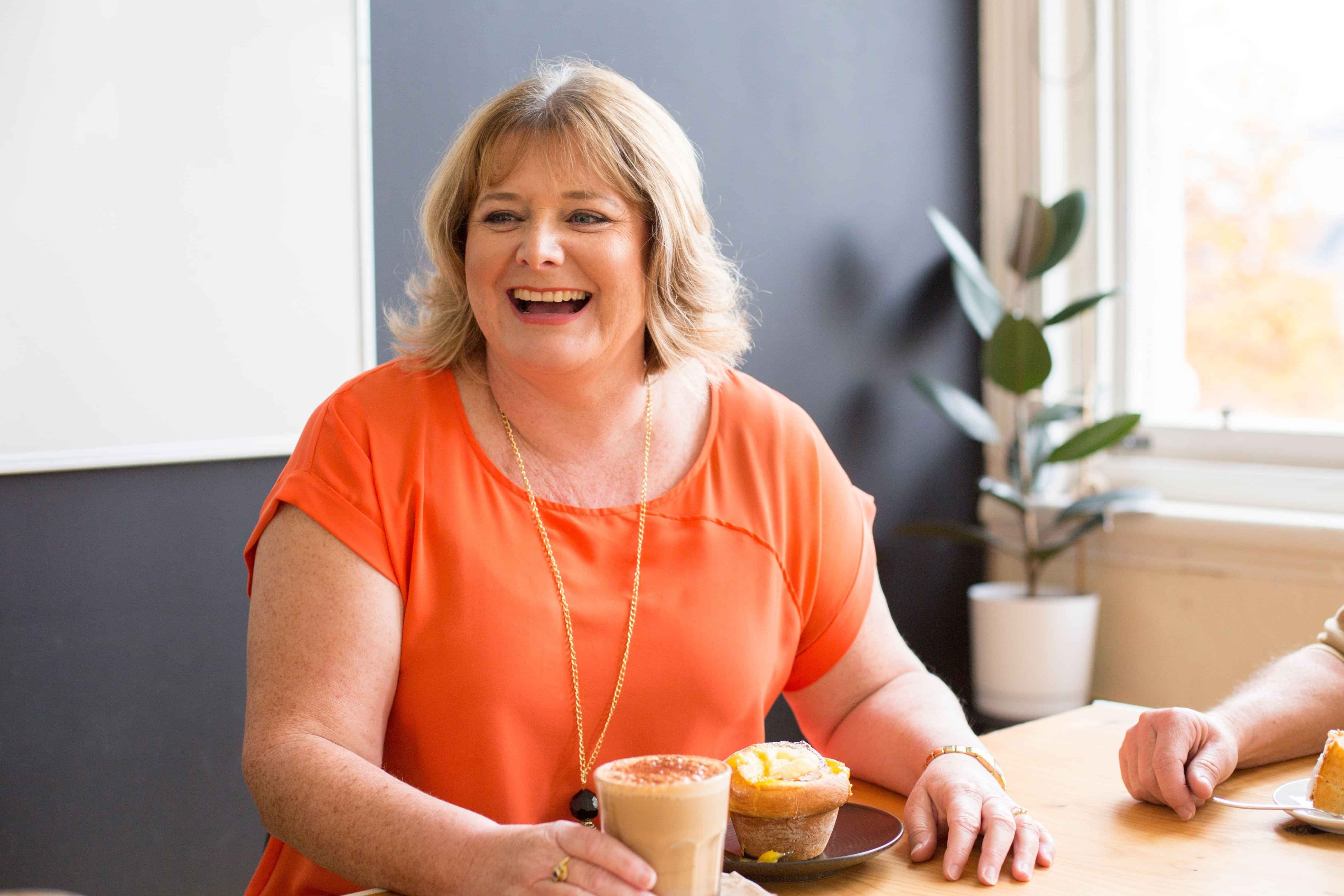 Image of Helen Laidlaw, Hamilton Business Advisor laughing with a client. Waikato, New Zealand.