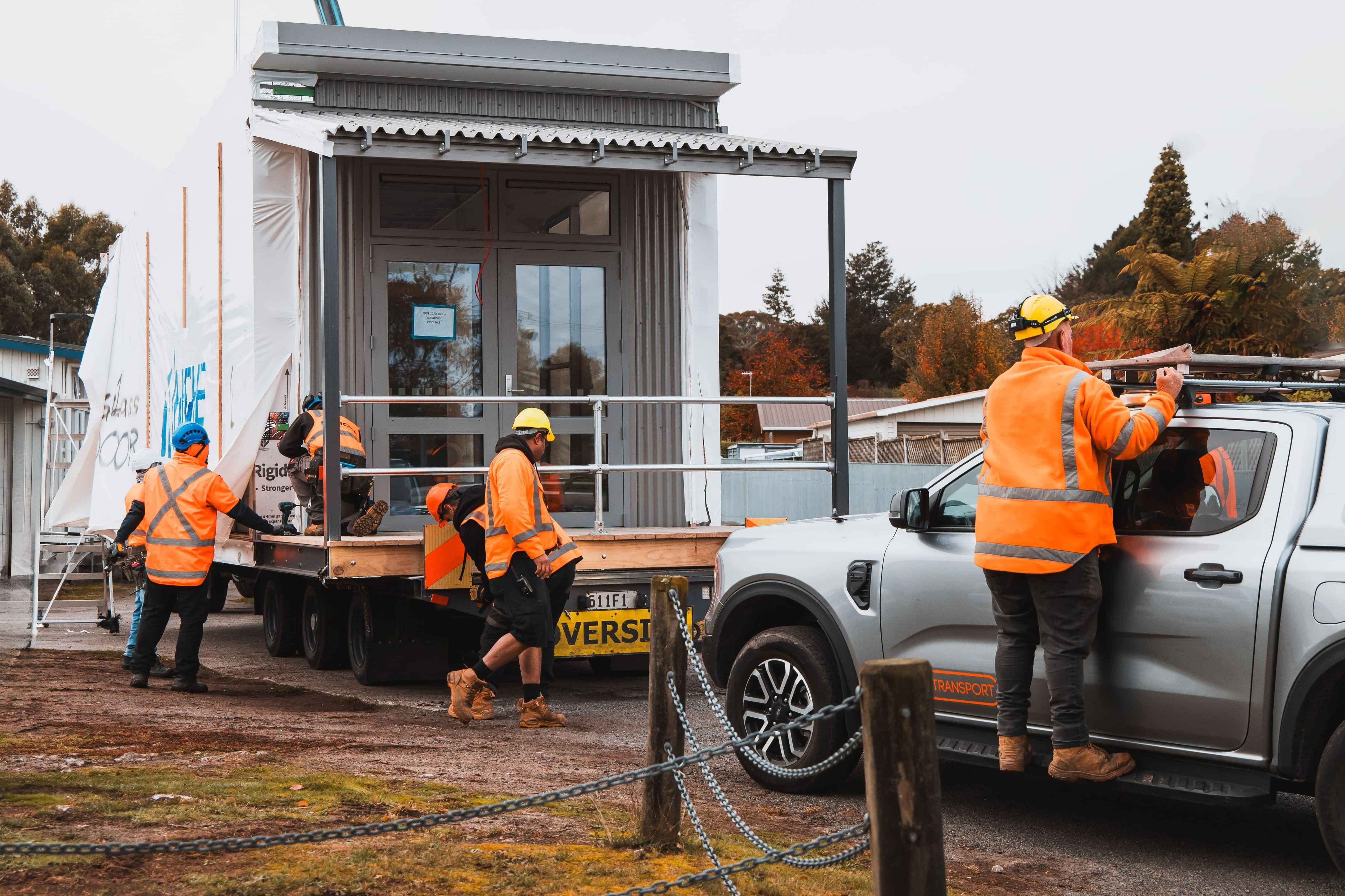 TDM transport staff on site transporting modular homes