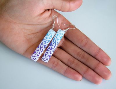 Click to see more: - Long drop graphic resin earrings