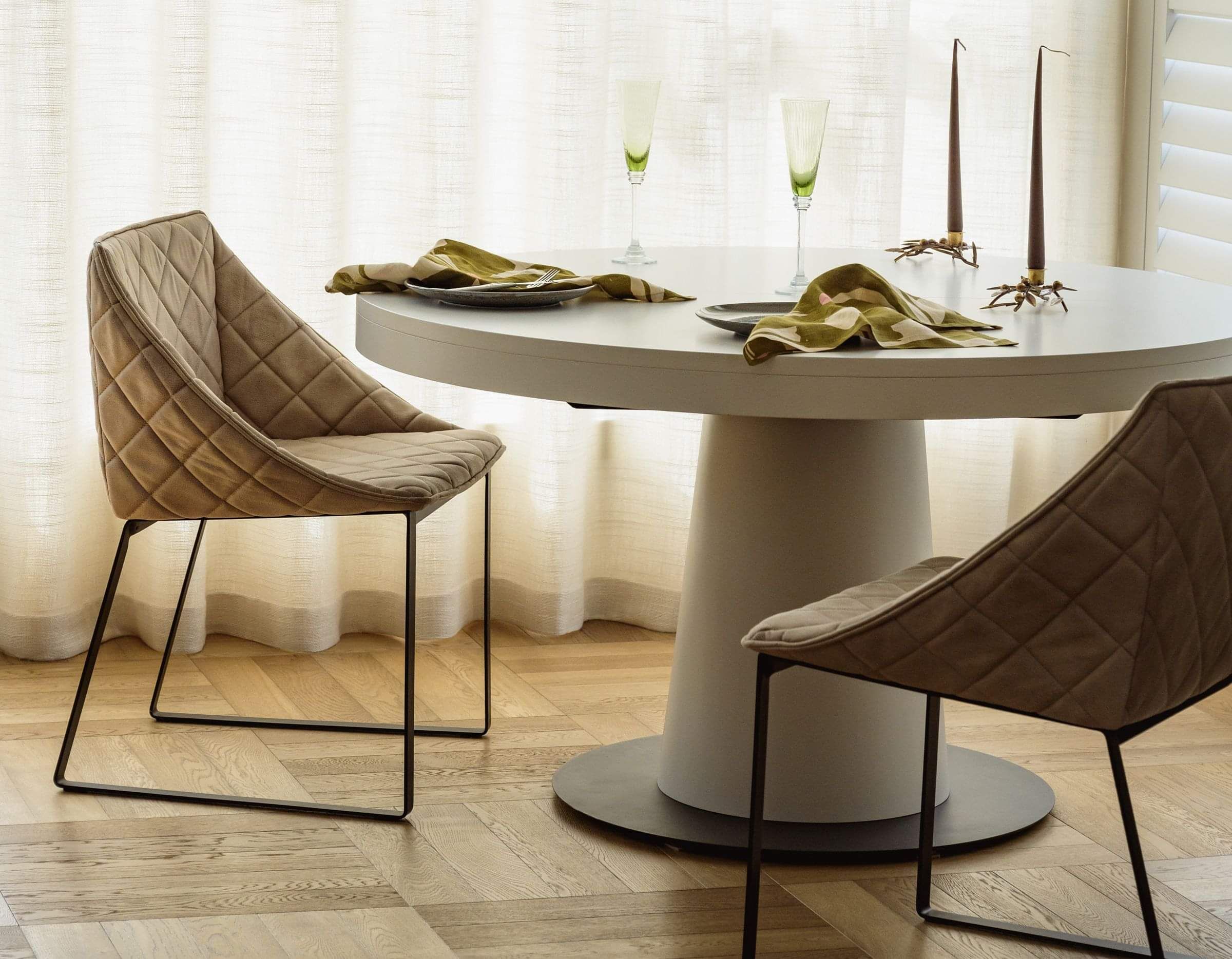 A modern kitchen with wood cupboards and breakfast bar and stools