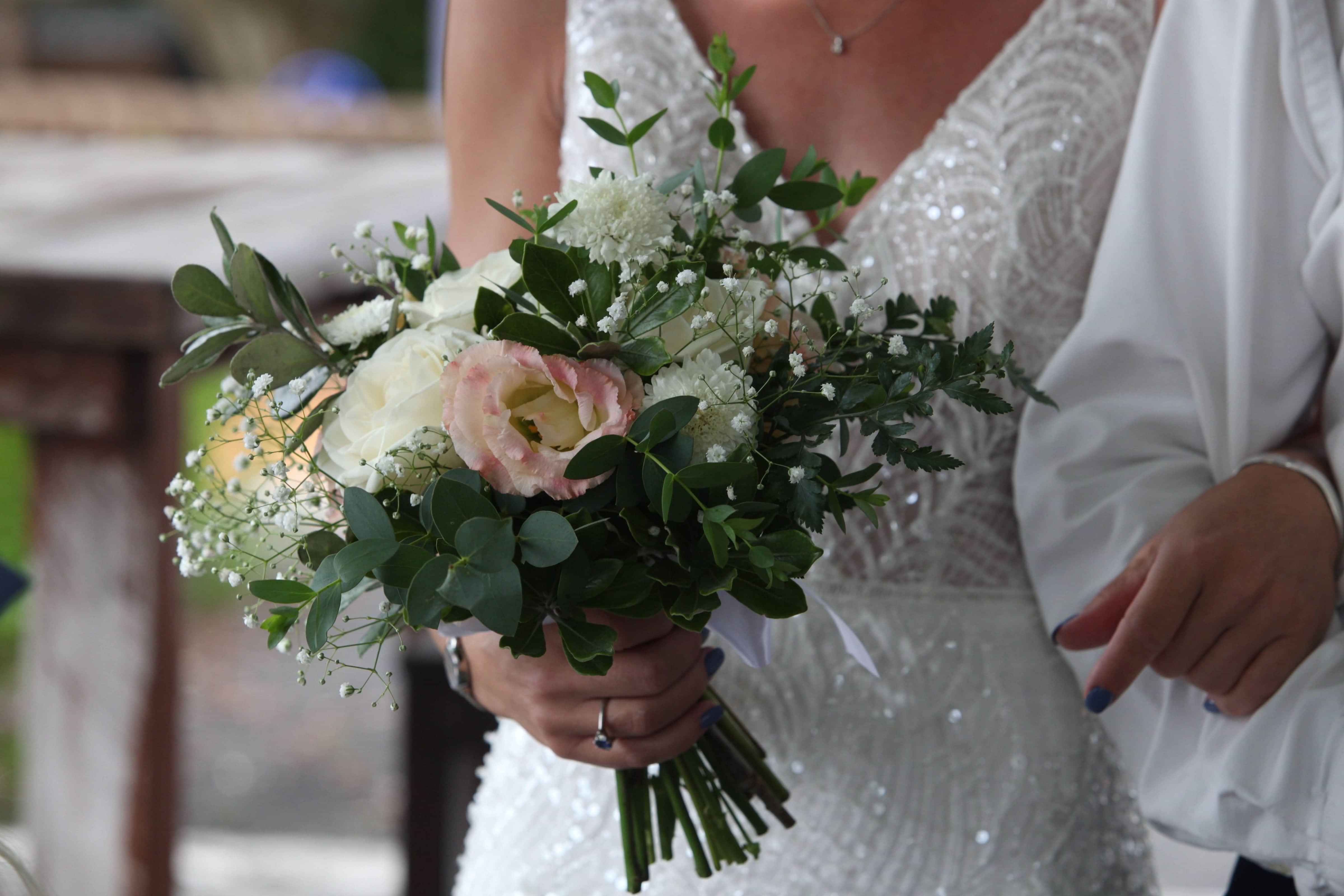 Bold blooms, rich green foliage in a ceramic vase for workplace florals by Raglan Florist Wild About Eve
