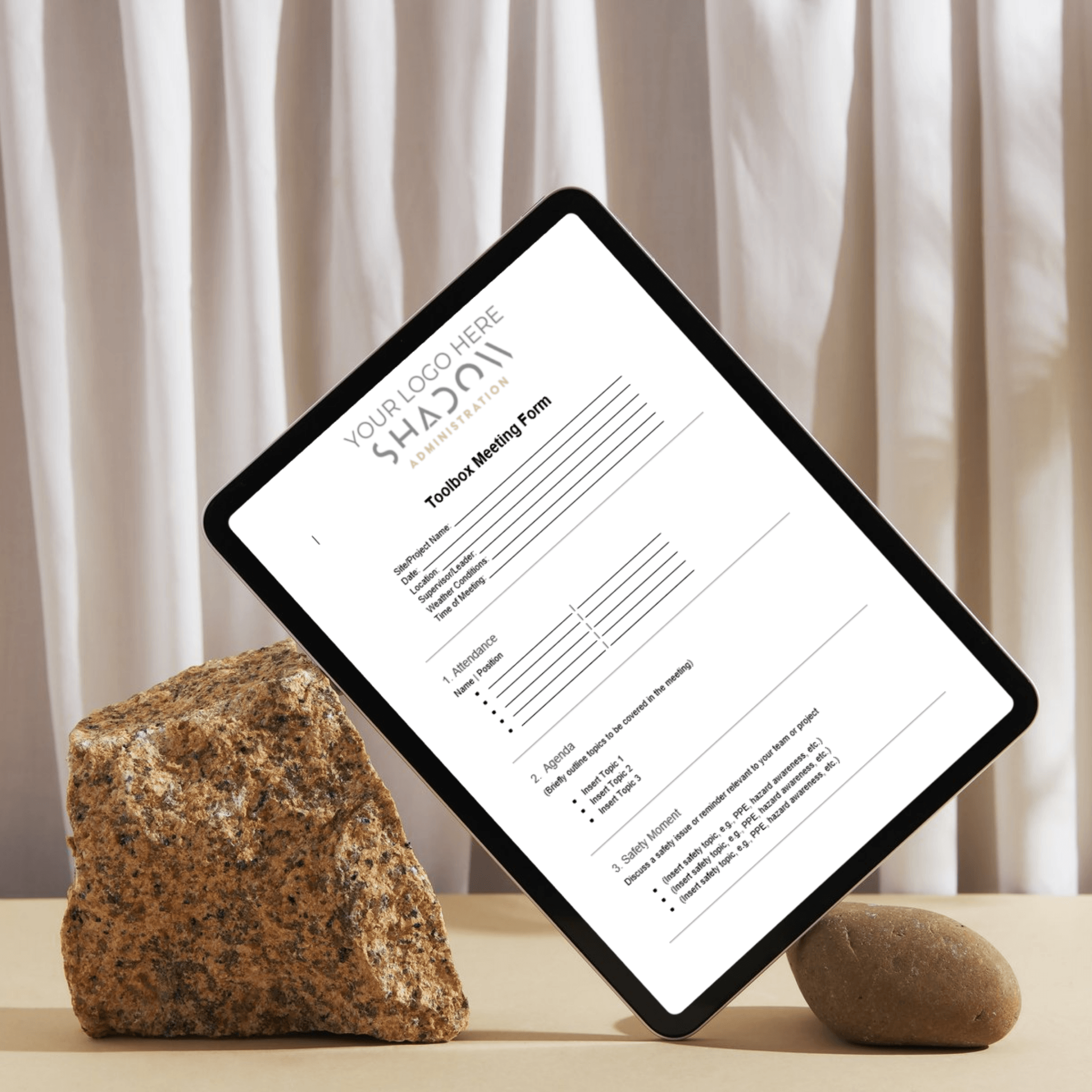 Tablet showing the Toolbox Meeting Form download for a trades business
