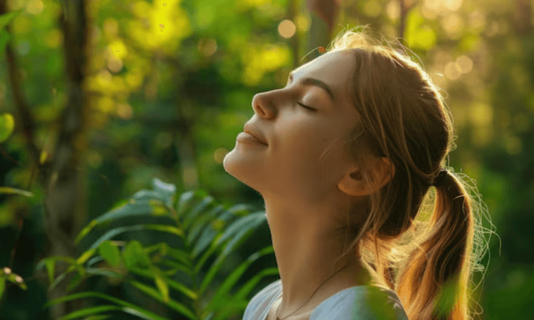 Relaxed, calm, peaceful, happy woman in nature  with Reiki
