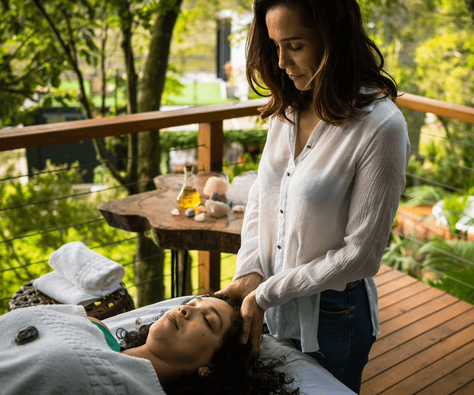 Yolanda sharing a relaxed Reiki treatment with students
