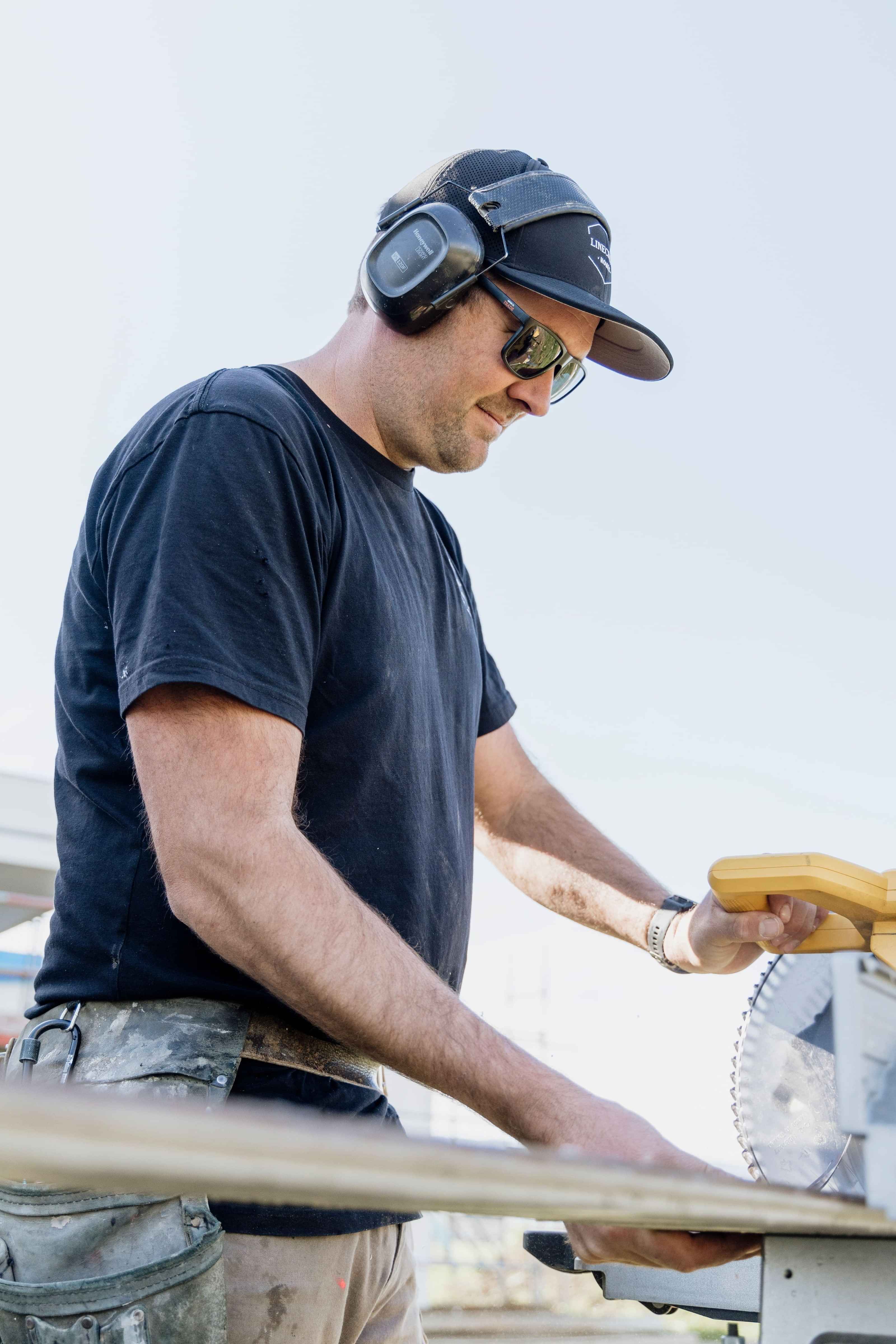 Luke head builder and owner of Linecrest Homes mid cut as he brings his client's dream home to life.