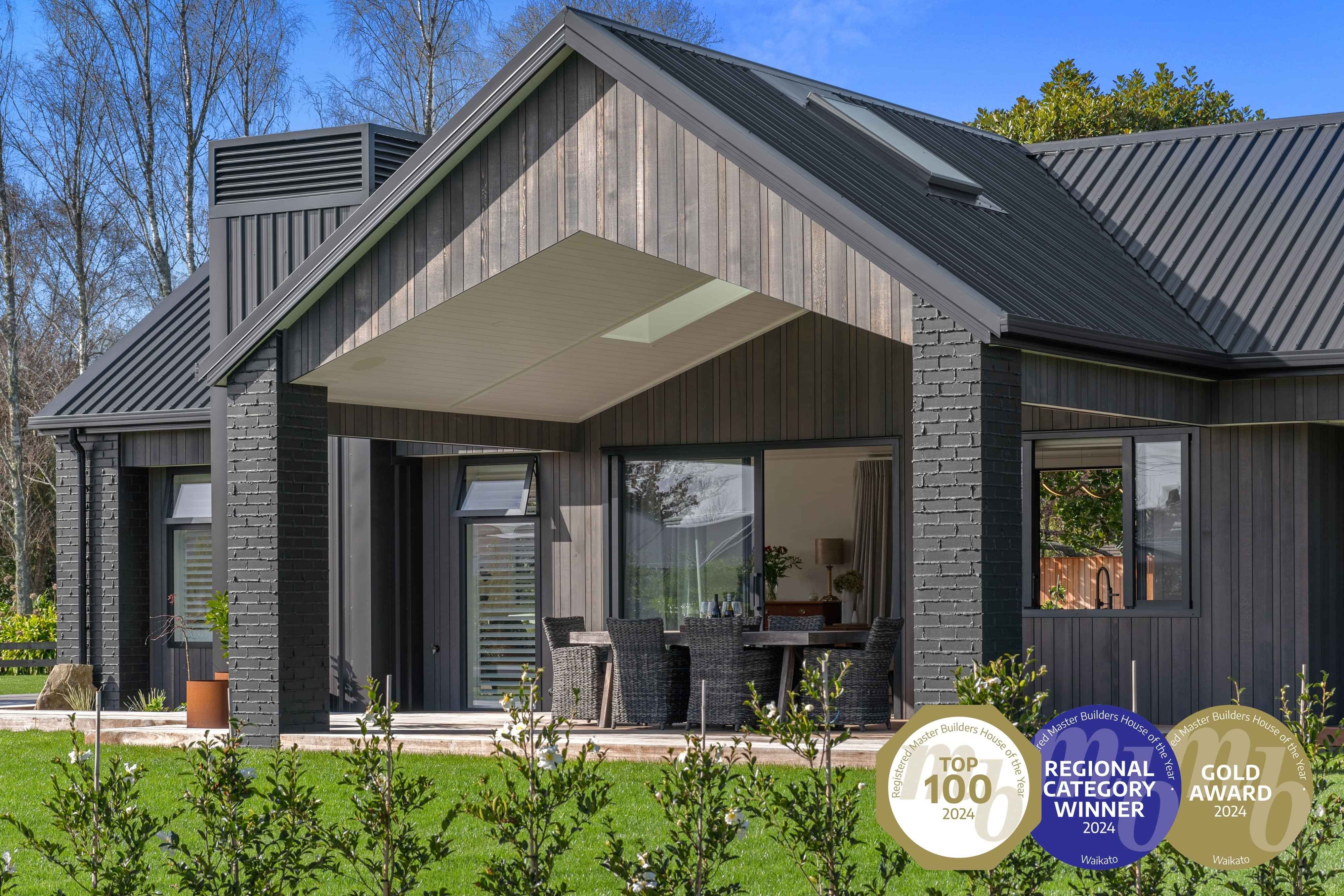 Award-winning Master Builder's house features a dark exterior pavilion-style home custom-built in Cambridge by Linecrest Homes