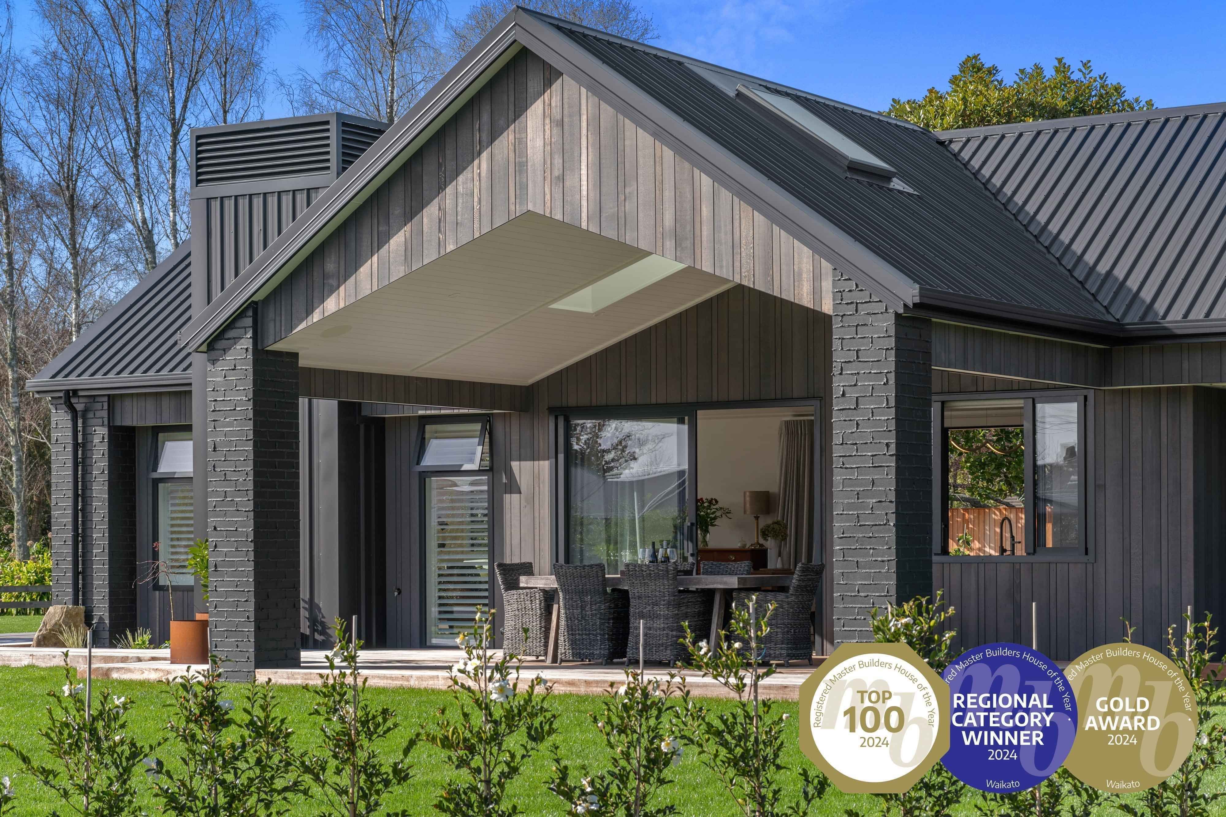 Award-winning Master Builder's house features a dark exterior pavilion-style home custom-built in Cambridge by Linecrest Homes