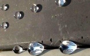 Water beading on concrete sealed with water repellent
