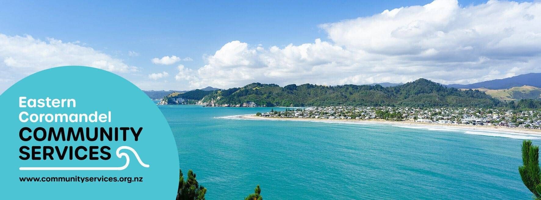 Wide shot of Whangamata beach and township