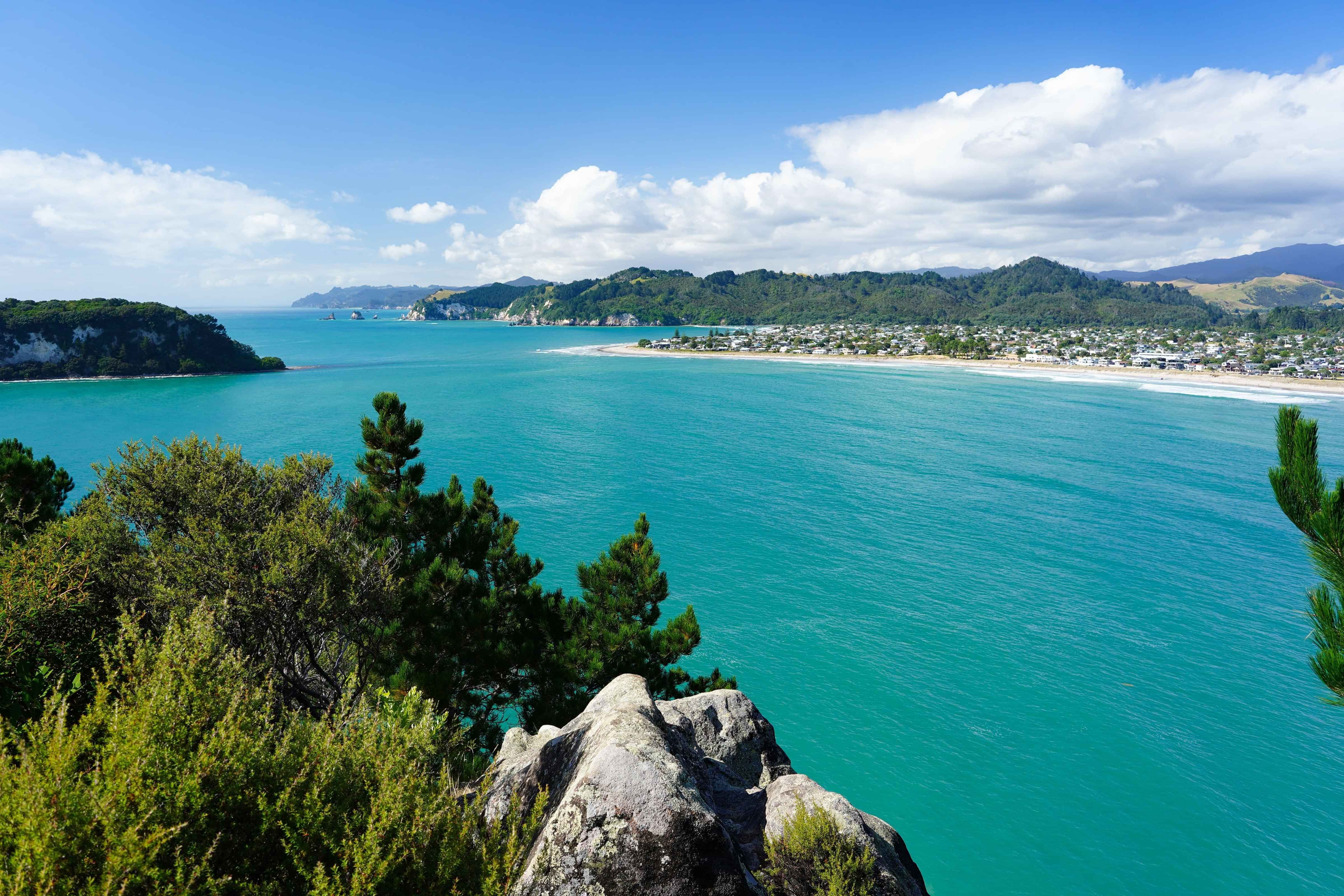 Wide shot of Whangamata beach and township