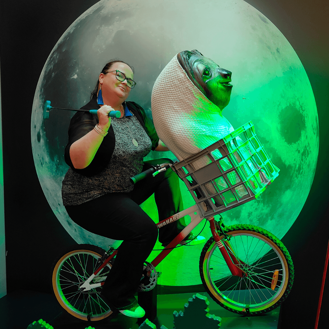 Nikki on a bike. Nota Bene social media and Pinterest Management