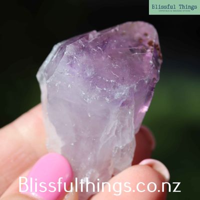 Amethyst Point with Goethite inclusion