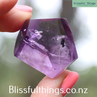 Amethyst Faceted Freeform with Hollandite inclusion
