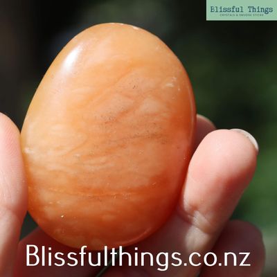 Apricot/Orange Calcite Palm Stone