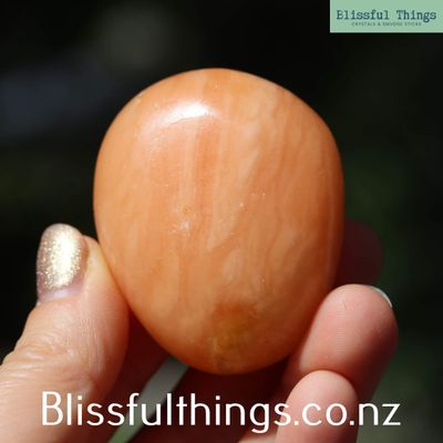 Apricot/Orange Calcite Palm Stone