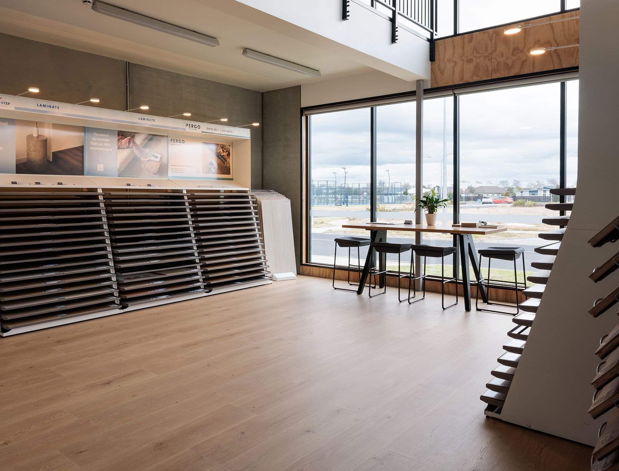 The interior of the Floorboards Showroom in Tauranga featuring hard surface flooring and samples.