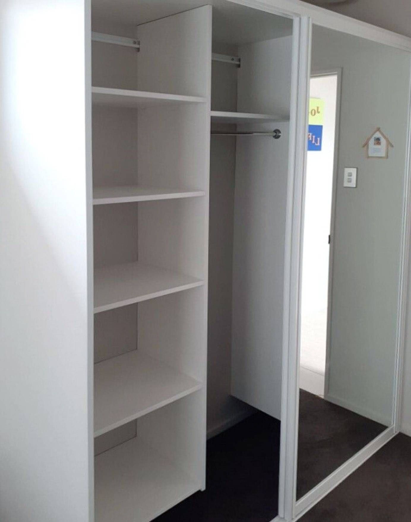 Custom made cupboard with sliding door in white.