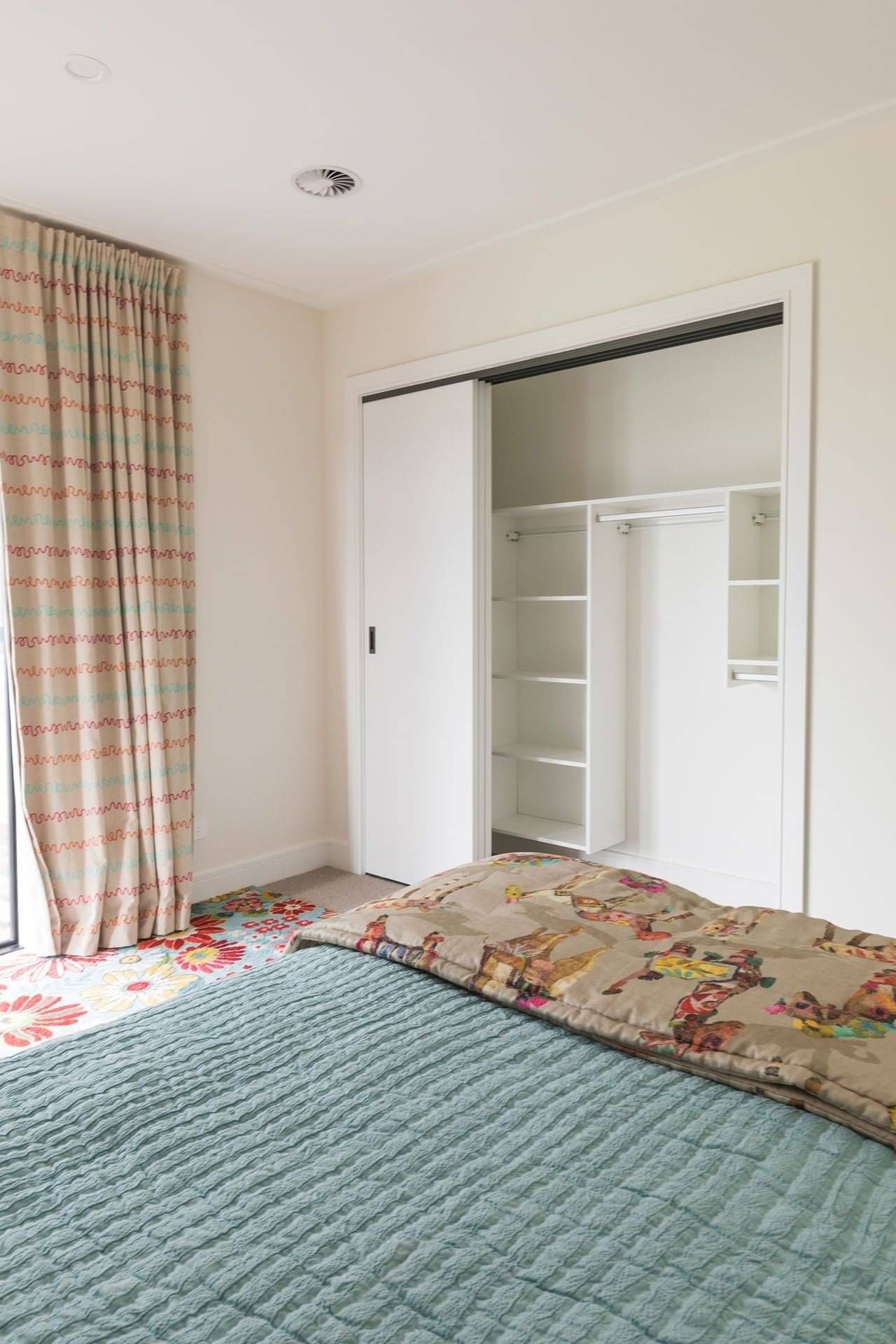 Nursery wardrobe with doors.