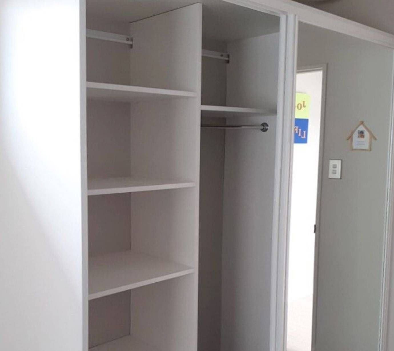 Srand alone wardrobe with doors.