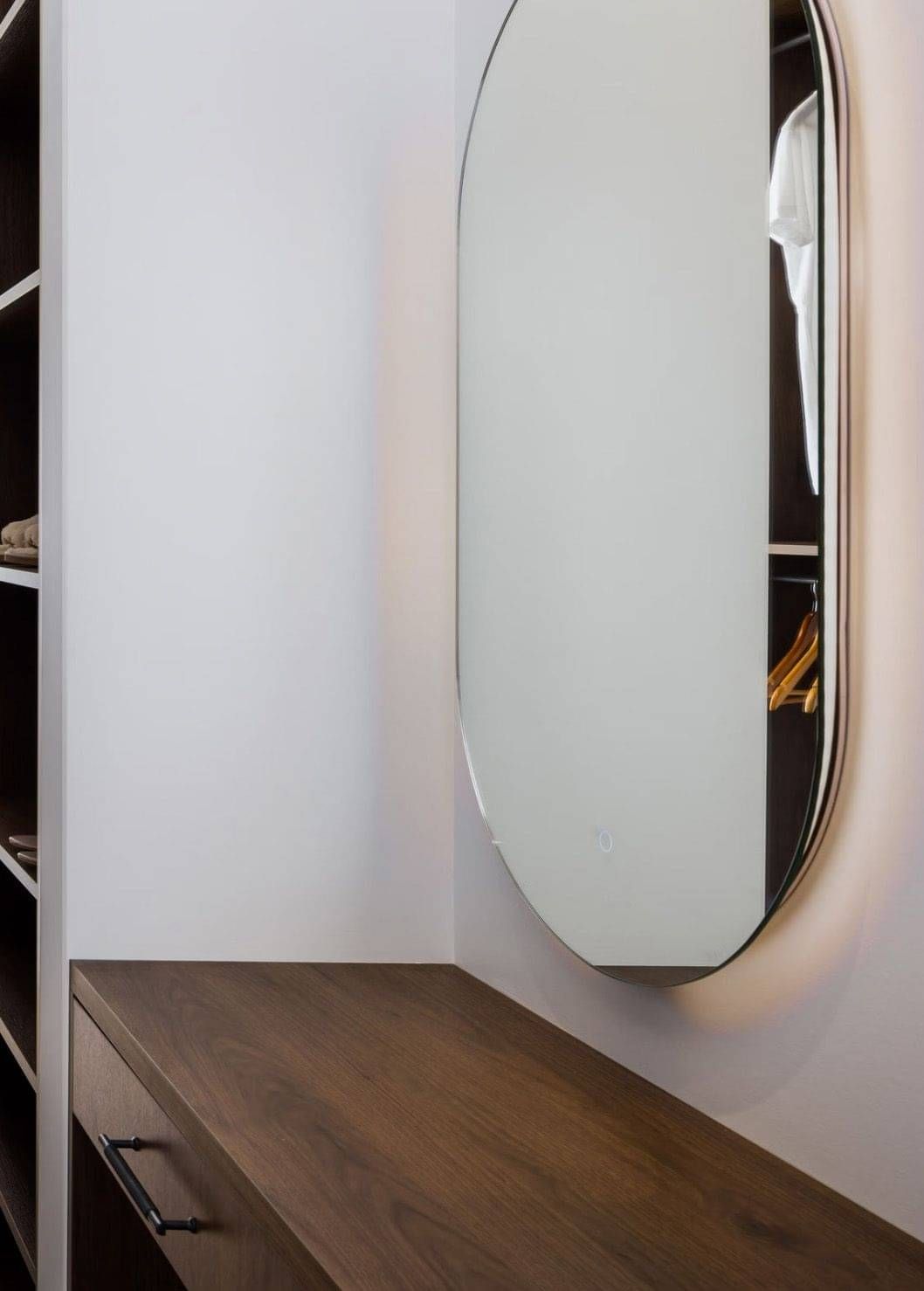 Built-in Vanity with wall mounted mirror above.