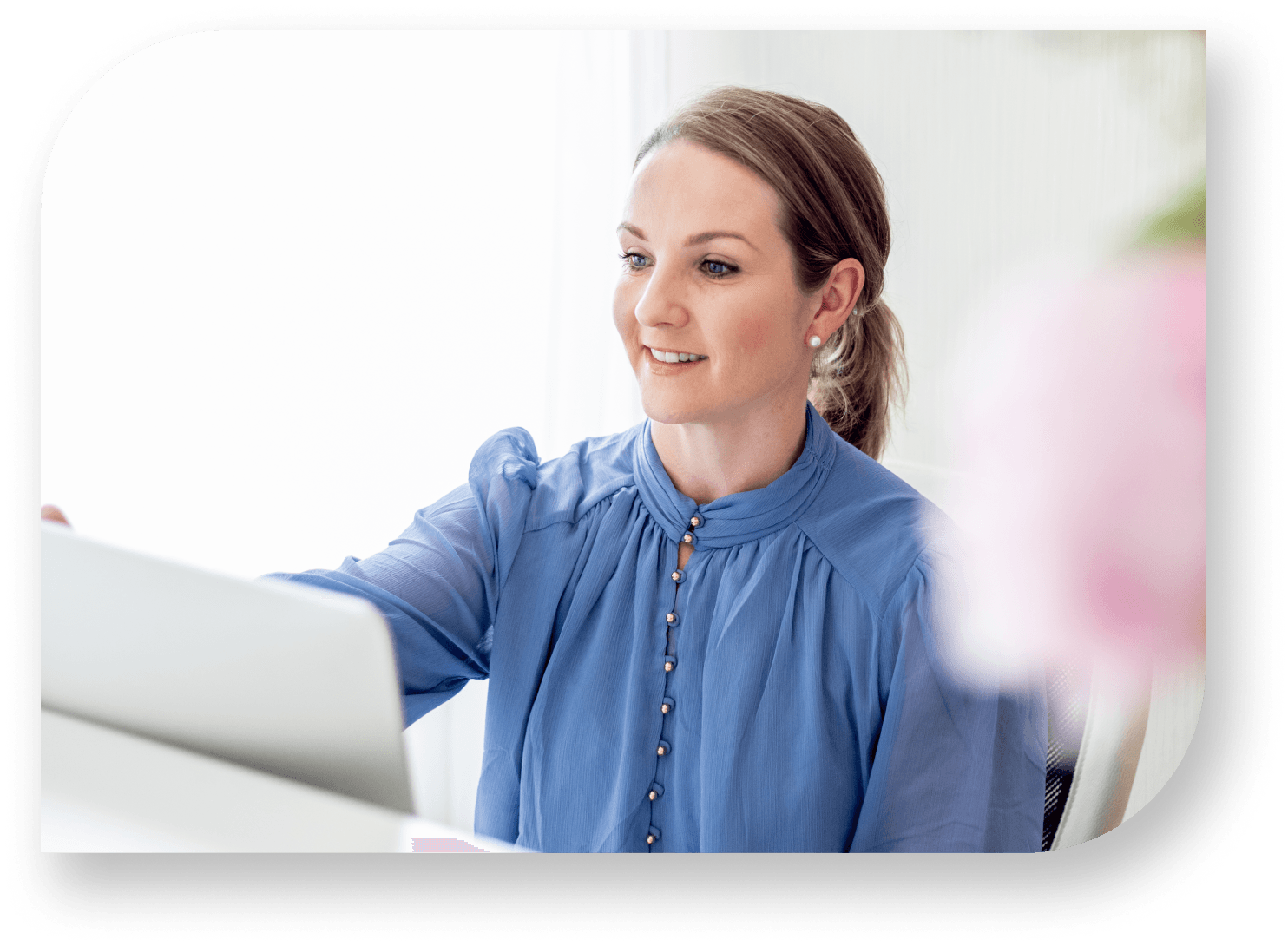 Receptionist greets client in clinic