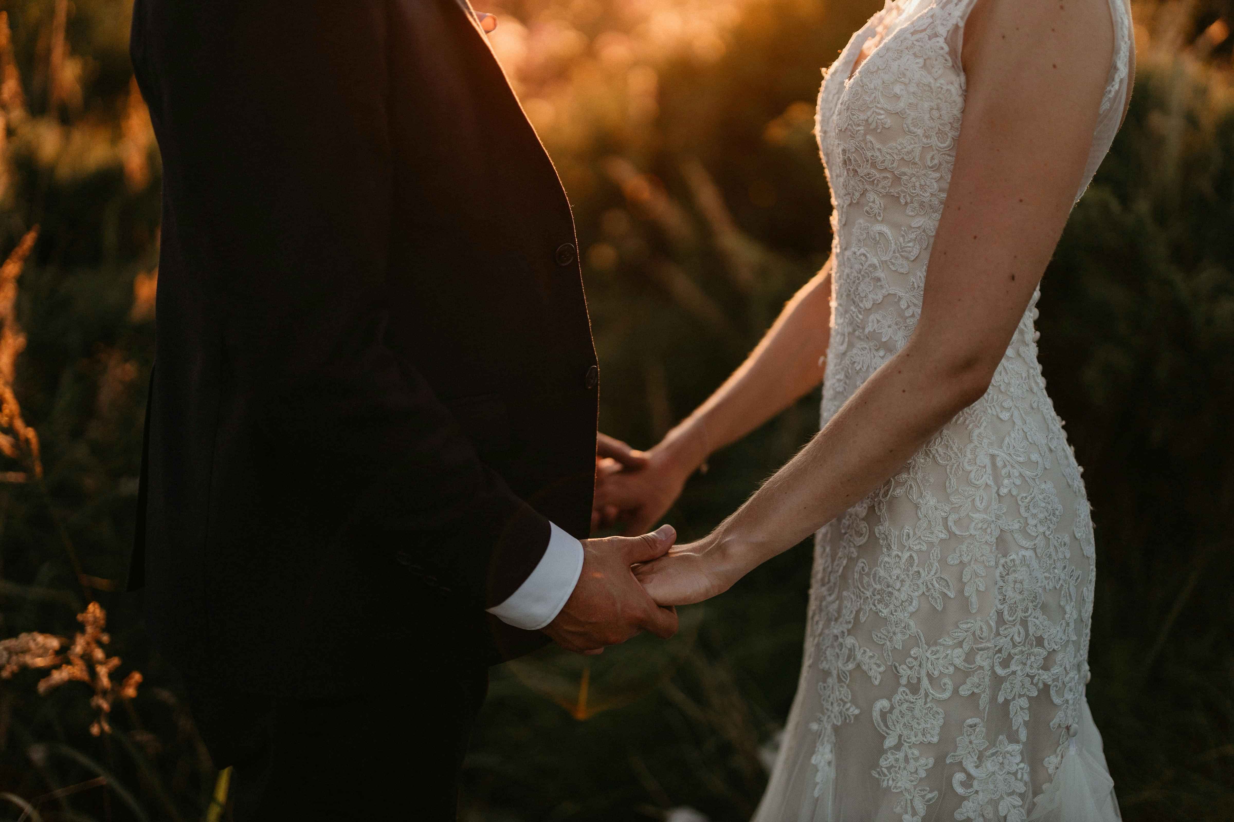 Couple holding hands during an intimate elopement ceremony