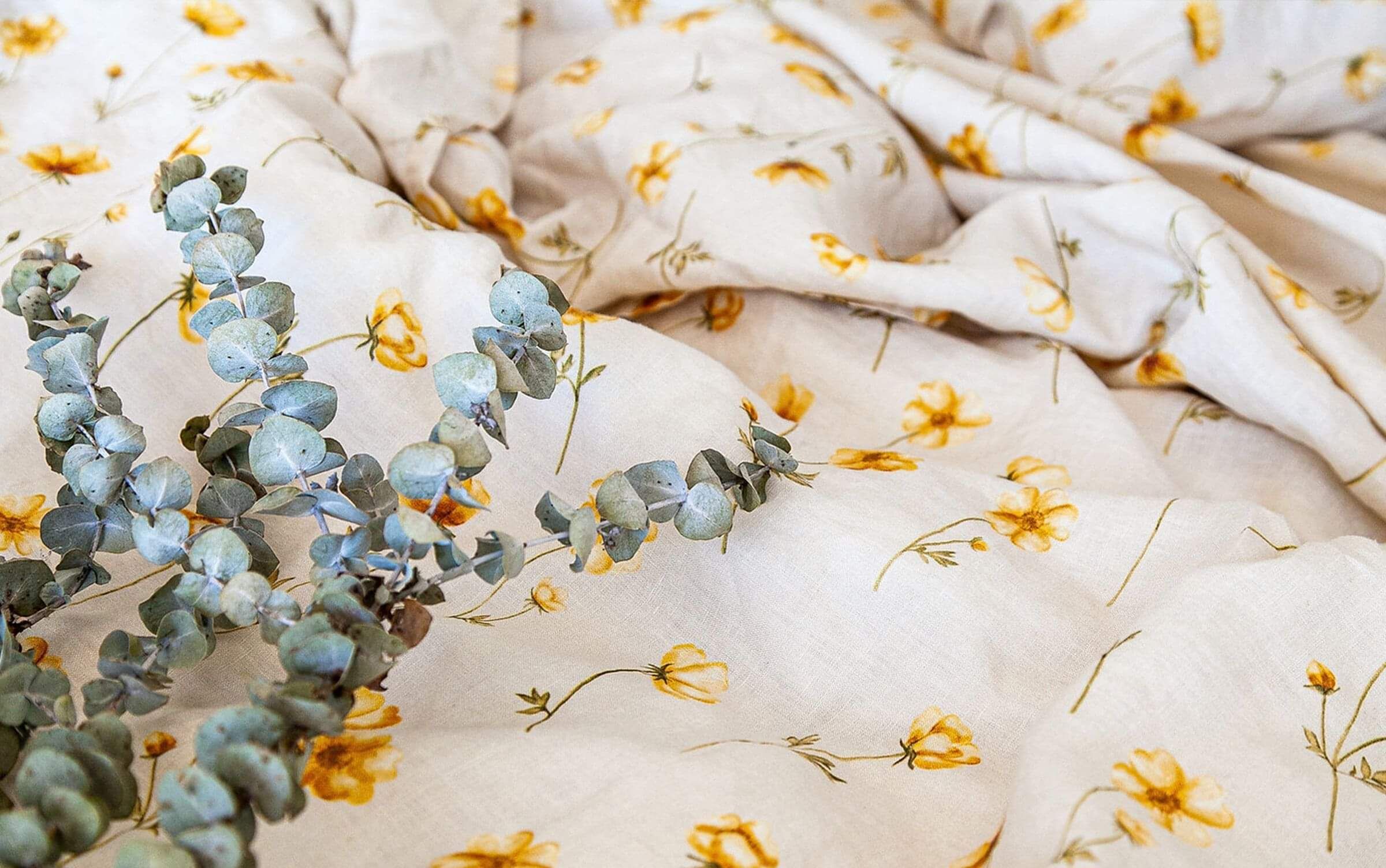 buttercups illustrated onto a linen bed spread