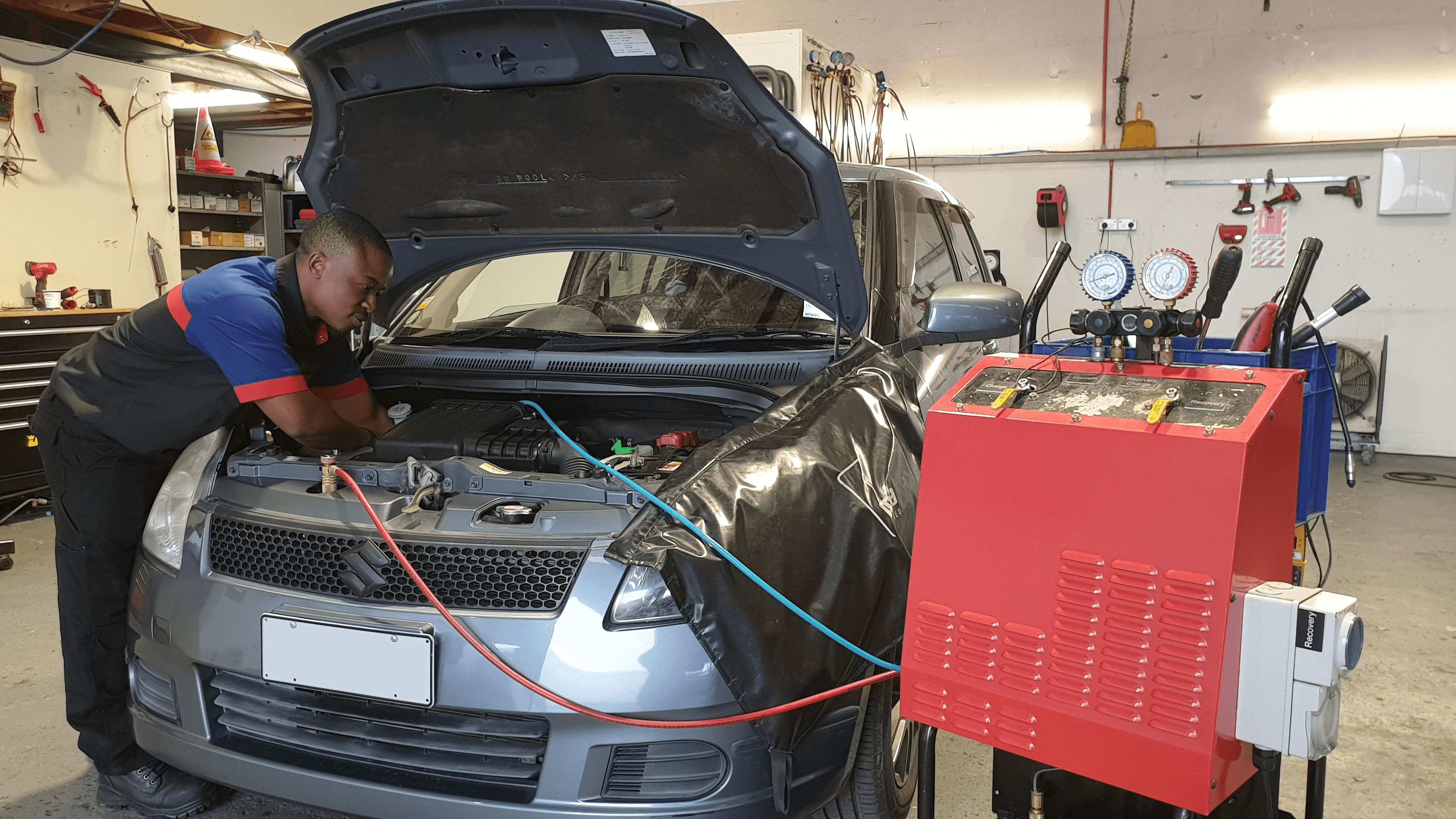 CoolCar technician de-gassing R134a system.
