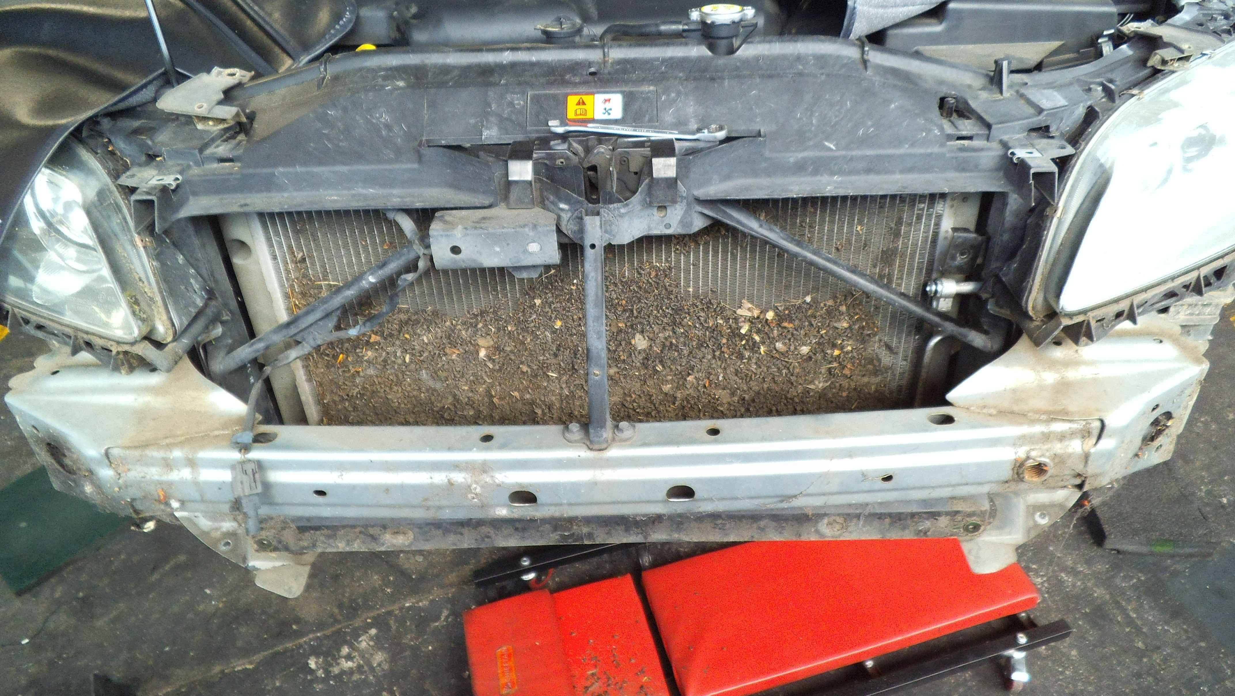 Condenser of truck, completely full of debris 