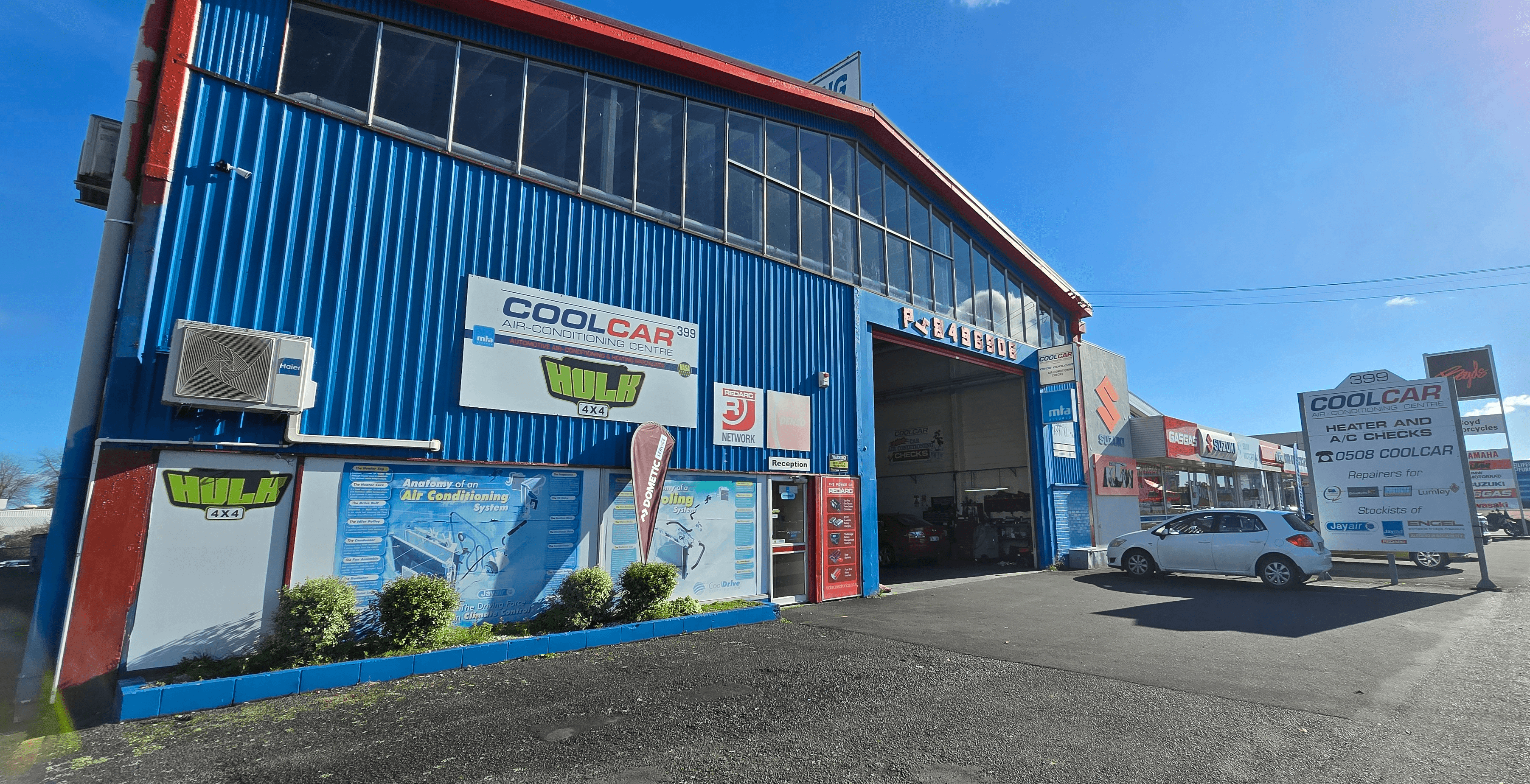 CoolCar ute and mobile van parked outside North Shore workshop on beautiful summer's day