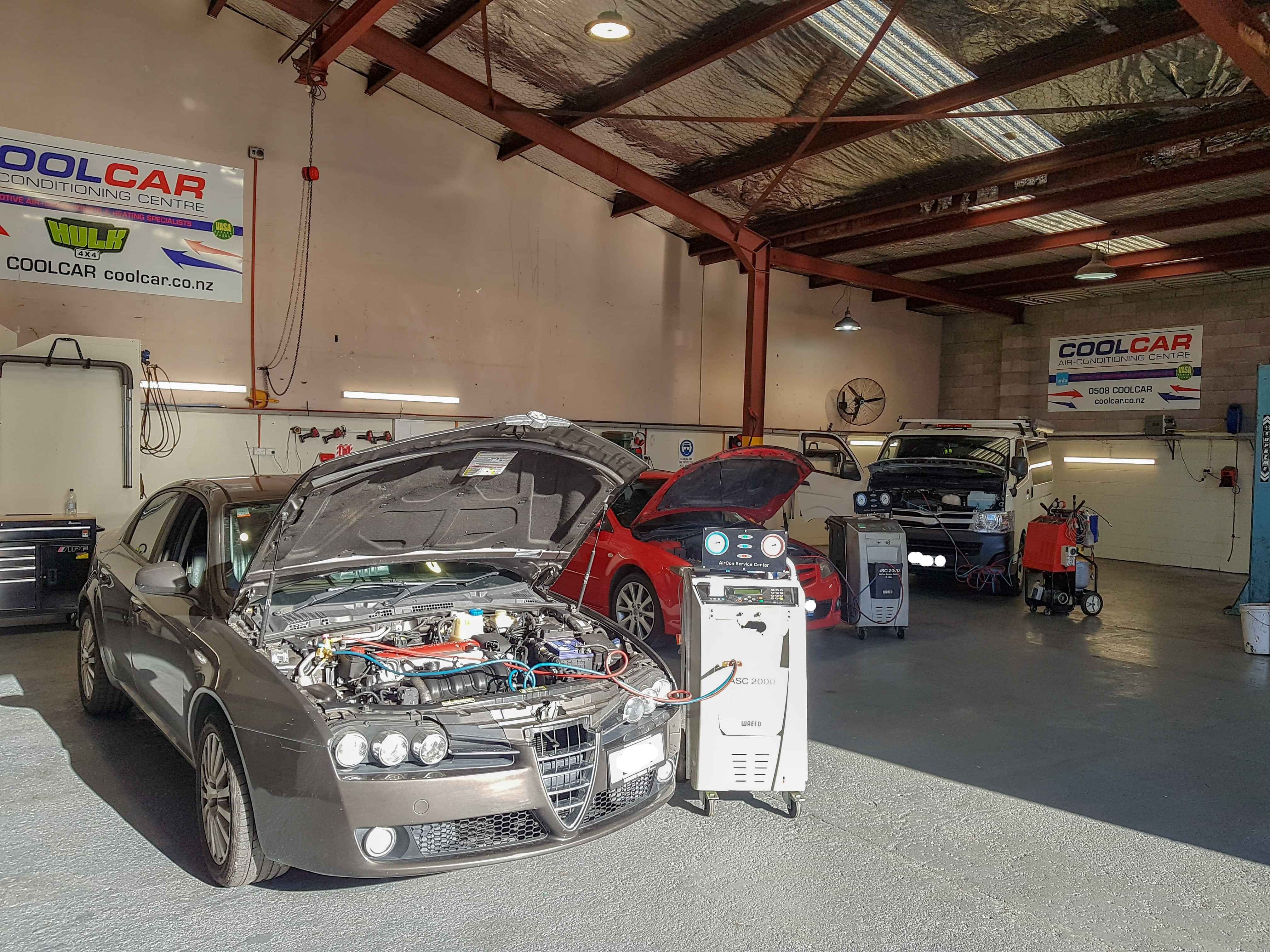 Cars being re-gassed inside CoolCar Henderson's workshop on sunny day
