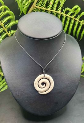 Carved Whale Bone Koru with Korus  WK032