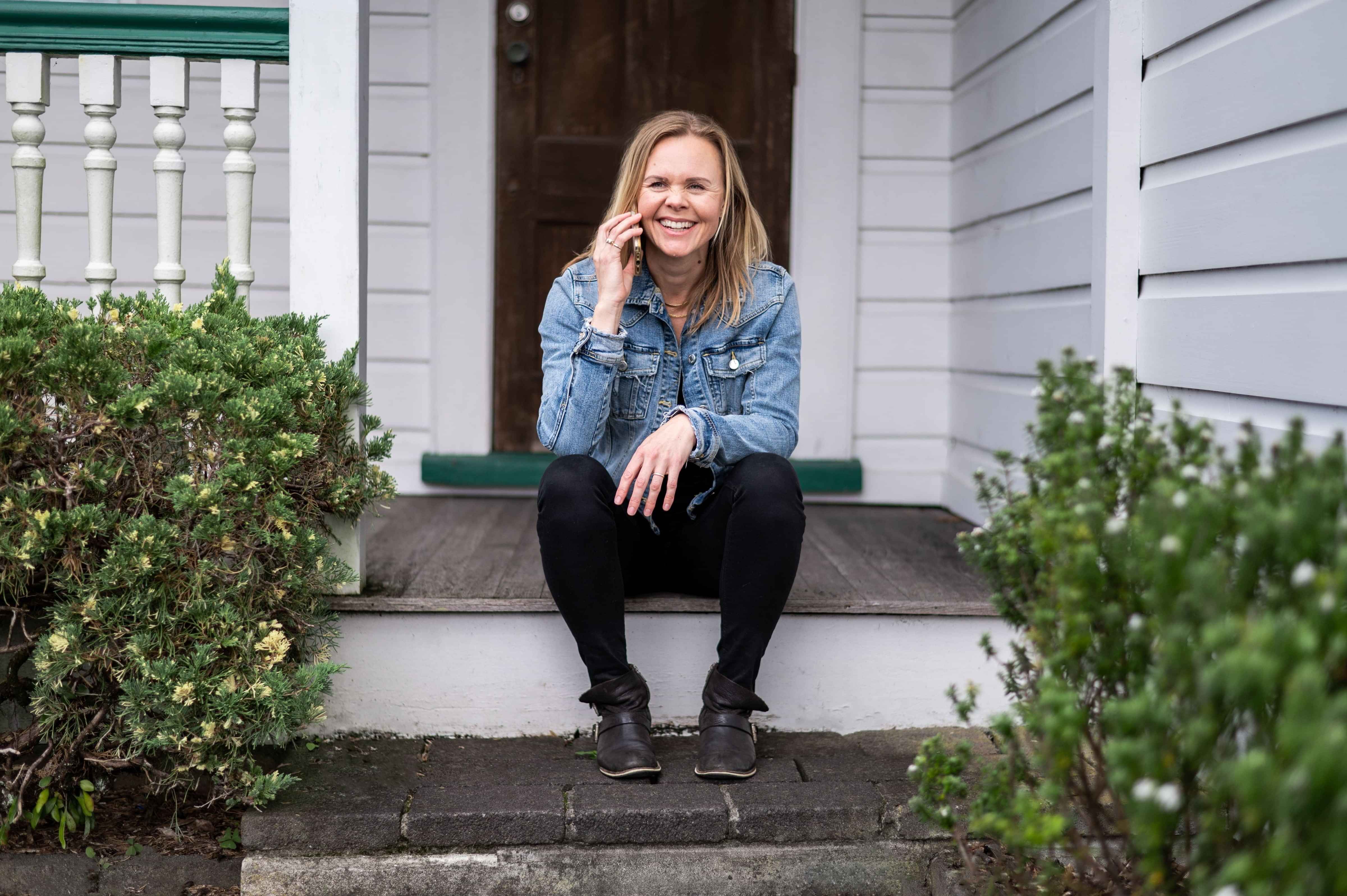 Pippa Jayne typing on a laptop, creating a content roadmap strategy for content inspiration. Black and white checked dress typing on a black laptop.