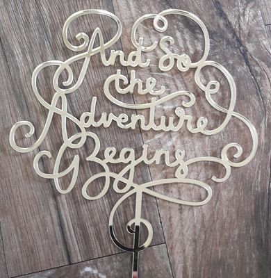 And so the adventure begins cake topper
