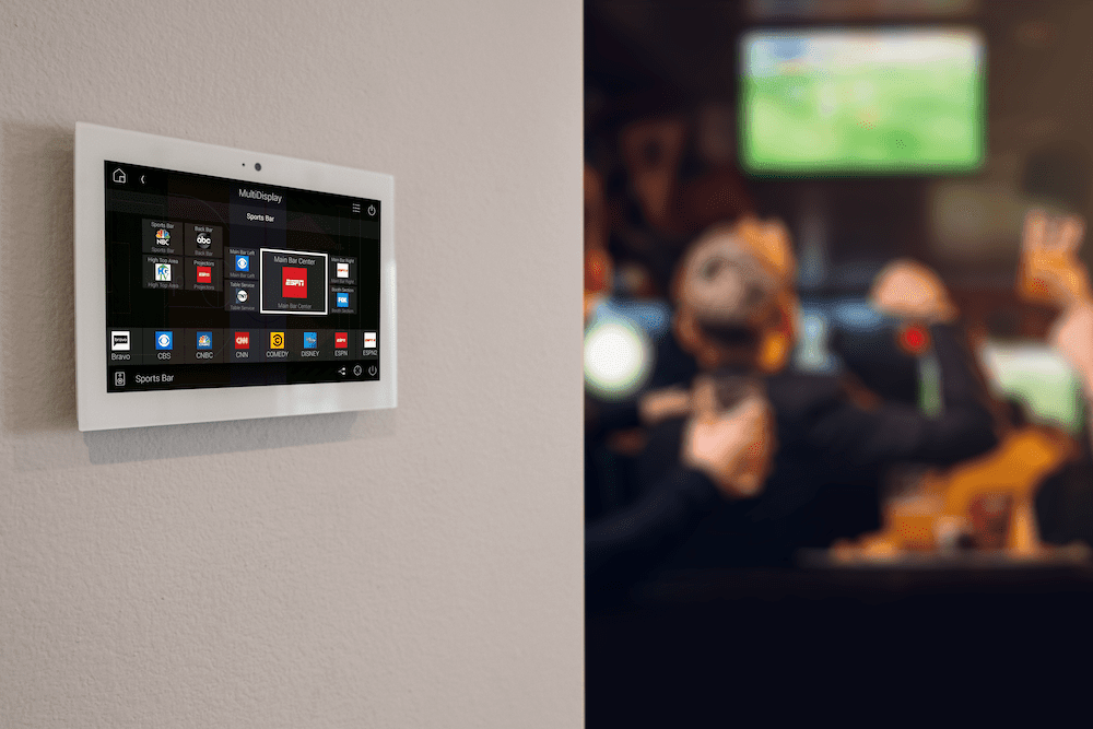 A wall mounted control panel in a entertainment room.
